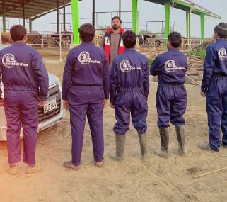 Dairy farm team in work uniforms
